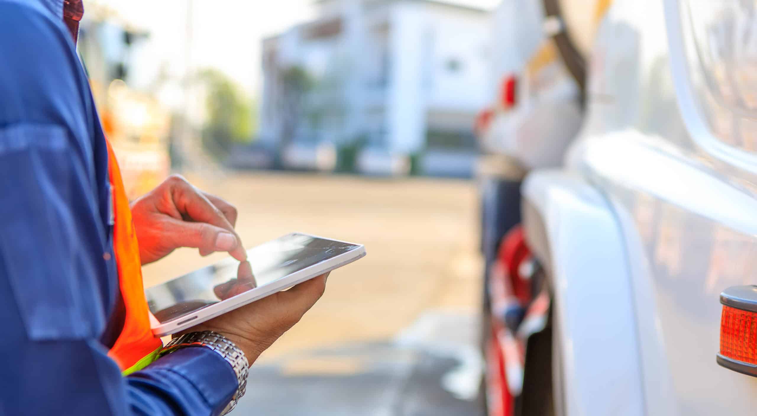 freight factoring, Truck,Drivers,Hand,Holding,Tablet,Checking,The,Product,List,driver,Writing